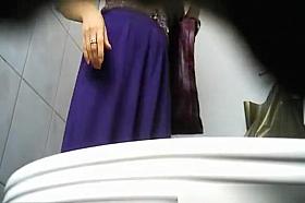 Long skirt woman peeing