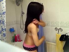 Yawning girl's bath time