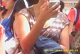 A dude is filming the cleavage of a hot babe