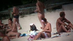 Intriguing, hot redhead in a nude beach video