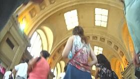 Voyeur underskirt video of a brunette woman on the station