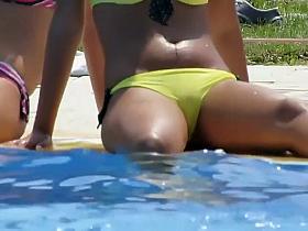 Attractive teen girl scratches her pussy