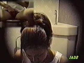 Toilet cam records amateur rubbing pussy through panty