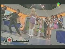 Blonde Latin bombshell makes upskirt magic on TV