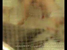 Oriental legal age teen getting dressed and voyeured