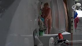 My chubby aunt gets caught on tape showering