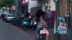 Red thong woman riding bike
