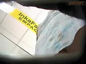 The narrow stripe of white thong up the skirt of amateur