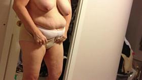 covering up her hard nipples,