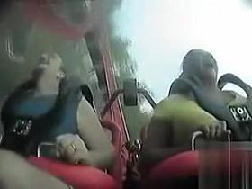 Big tits bounce during a roller coaster ride