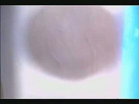 Bikini babe wahsing her shaved pussy in the shower