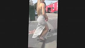 Strong wind plays with a Turkish girl's revealing dress
