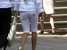 Checking out a fashionable girl's ass