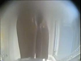 Hidden camera in the shower shoots babe with hairy pussy