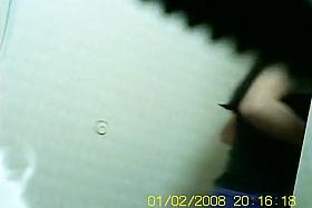 Lovely coed caught on a bathroom hidden cam