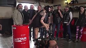 Brunette slave fucks in bikers shop