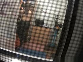 Spy camera catches neighbor in her bedroom undressing