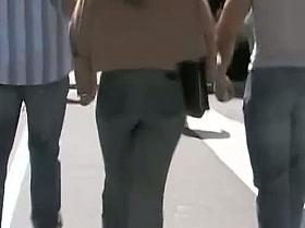 Beautiful street candid is being video taped by a voyeur guy