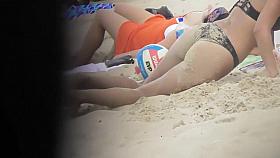 Drunk blond girl gets dirty on beach