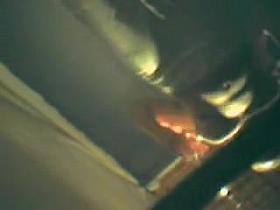 Dressed girl in fitting room is spied from below