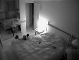 Leggy lady in boots masturbates across from the mirror