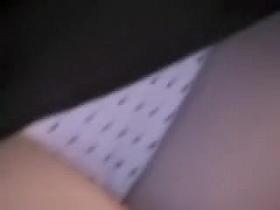 Babe is sitting and flashing white panty up skirt