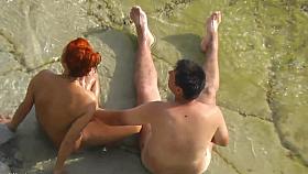 Voyeur. Guy wanking and fuck redhead girl on a public beach