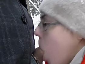 Beauty gives a blowjob out in the snow