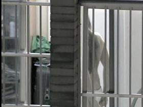 Long haired doll erotically moving in panty in the window