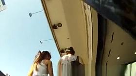 Two friends upskirted in street