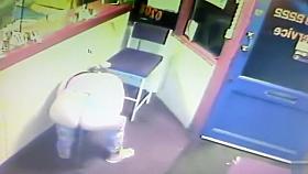 Blonde woman pisses right in front of the receptionist's desk