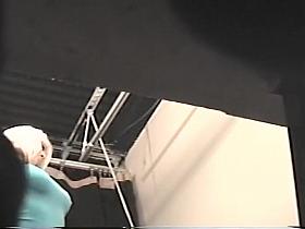 Spying her shaved pussy trying a bikini