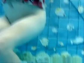 Busty mature woman filmed under water