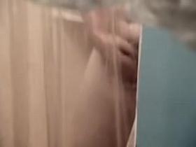 Fem butt and crotch reflected in the shower mirror spied