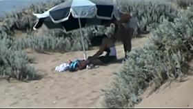 Couple making out on the beach