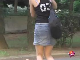 Hot oriental bimbo flashes her underwear when somebody pulls her skirt