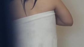 Japanese babe plays with her aching pussy on voyeur camera