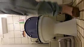 Woman peeing in bathroom