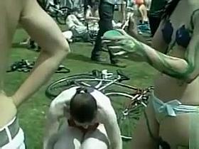 Naturist girls and guys have their completely naked bodies painted