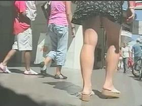 Upskirt scene with fascinating blonde in short dress and white panties