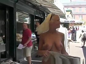 Busty blonde walking naked in public