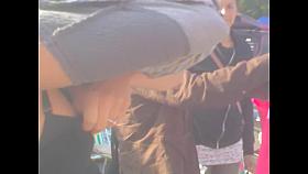 Candid downblouse of the amateur fem in the street