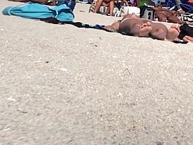 Beautiful Latina showing her pussy on nude beach