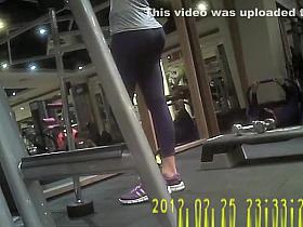 Woman in dark sports pants exercising