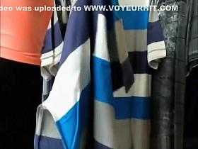 Woman in black leggings checking some clothes