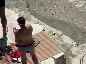 Nude woman refreshing in the water