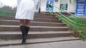 White coat, black boots, tan stockings