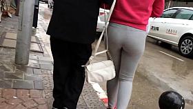bubble butt in grey yoga pants walking the street