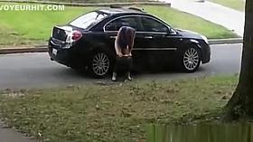 Totally drunk woman peeing on cars
