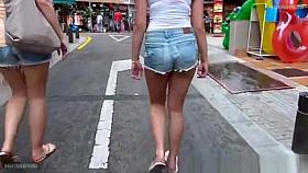 Two girls with sexy butts.